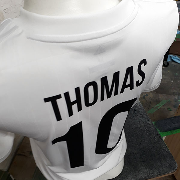 white soccer jersey with name and number